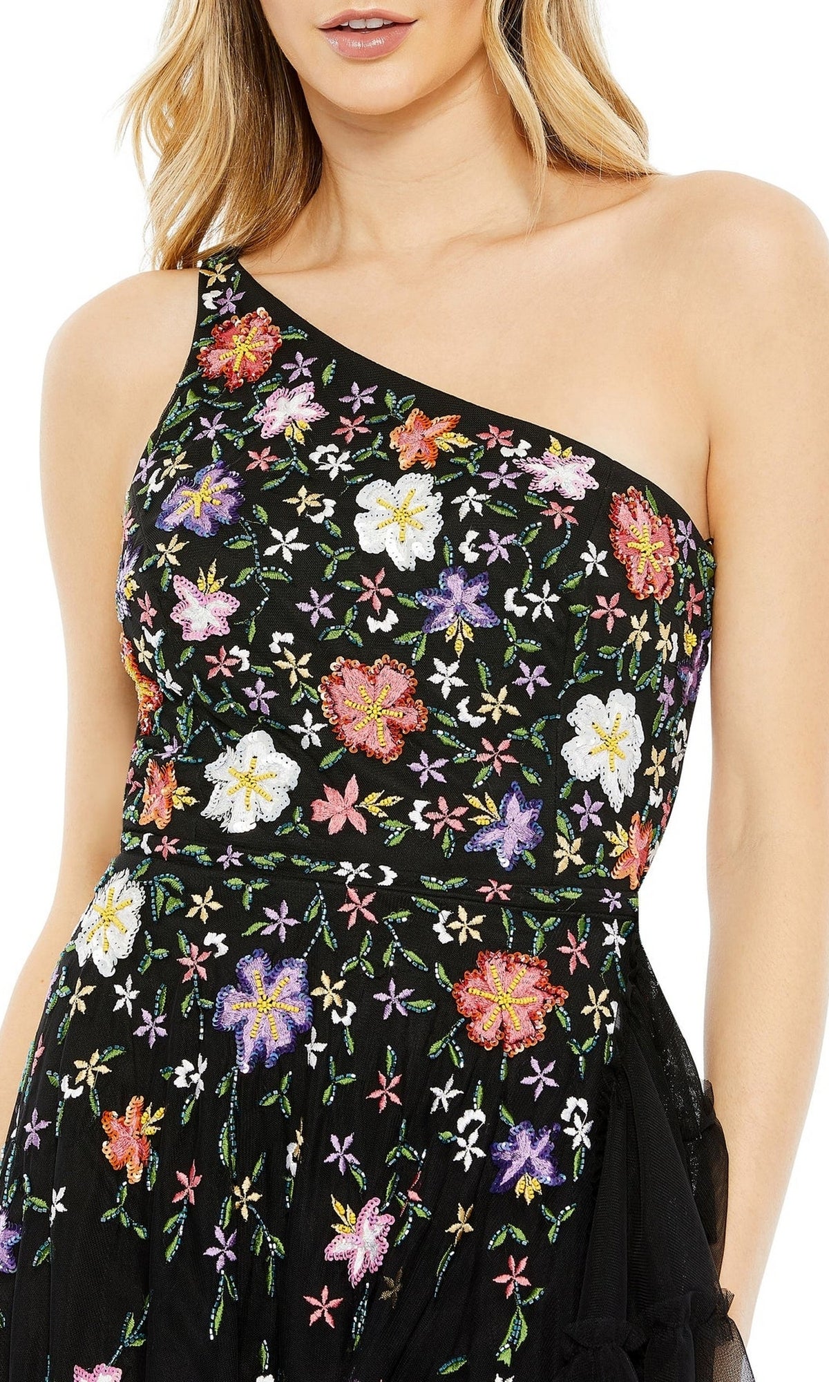 A woman wears the Mac Duggal 9164, a one-shoulder floral formal dress with multicolored embroidery—an elegant choice for special occasions.